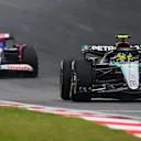 SHANGHAI, CHINA - APRIL 21: Lewis Hamilton of Great Britain driving the (44) Mercedes AMG Petronas F1 Team W15 leads Daniel Ricciardo of Australia driving the (3) Visa Cash App RB VCARB 01 on track during the F1 Grand Prix of China at Shanghai International Circuit on April 21, 2024 in Shanghai, China. (Photo by Clive Mason - Formula 1/Formula 1 via Getty Images)