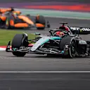 SHANGHAI, CHINA - APRIL 21: George Russell of Great Britain driving the (63) Mercedes AMG Petronas F1 Team W15 leads Oscar Piastri of Australia driving the (81) McLaren MCL38 Mercedes on track during the F1 Grand Prix of China at Shanghai International Circuit on April 21, 2024 in Shanghai, China. (Photo by Lintao Zhang/Getty Images )