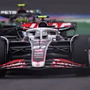 SHANGHAI, CHINA - APRIL 21: Nico Hulkenberg of Germany driving the (27) Haas F1 VF-24 Ferrari leads Lewis Hamilton of Great Britain driving the (44) Mercedes AMG Petronas F1 Team W15 on track during the F1 Grand Prix of China at Shanghai International Circuit on April 21, 2024 in Shanghai, China. (Photo by Lars Baron/Getty Images)