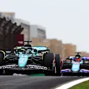 SHANGHAI, CHINA - APRIL 19: Lance Stroll of Canada driving the (18) Aston Martin AMR24 Mercedes & Esteban Ocon of France driving the (31) Alpine F1 A524 Renault on track during practice ahead of the F1 Grand Prix of China at Shanghai International Circuit on April 19, 2024 in Shanghai, China. (Photo by Mark Thompson/Getty Images)