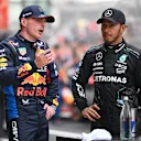 SHANGHAI, CHINA - APRIL 20: Sprint winner Max Verstappen of the Netherlands and Oracle Red Bull Racing and Second placed Lewis Hamilton of Great Britain and Mercedes look on in parc ferme during the Sprint ahead of the F1 Grand Prix of China at Shanghai International Circuit on April 20, 2024 in Shanghai, China. (Photo by Clive Mason - Formula 1/Formula 1 via Getty Images)