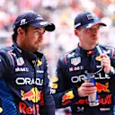 SHANGHAI, CHINA - APRIL 20: Sprint winner Max Verstappen of the Netherlands and Oracle Red Bull Racing and Third placed Sergio Perez of Mexico and Oracle Red Bull Racing look on in parc ferme during the Sprint ahead of the F1 Grand Prix of China at Shanghai International Circuit on April 20, 2024 in Shanghai, China. (Photo by Bryn Lennon - Formula 1/Formula 1 via Getty Images)