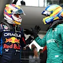 SHANGHAI, CHINA - APRIL 20: Second placed qualifier Sergio Perez of Mexico and Oracle Red Bull Racing and Third placed qualifier Fernando Alonso of Spain and Aston Martin F1 Team celebrate in parc ferme after qualifying ahead of the F1 Grand Prix of China at Shanghai International Circuit on April 20, 2024 in Shanghai, China. (Photo by Bryn Lennon - Formula 1/Formula 1 via Getty Images)