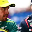 SHANGHAI, CHINA - APRIL 20: Third placed qualifier Fernando Alonso of Spain and Aston Martin F1 Team and Second placed qualifier Sergio Perez of Mexico and Oracle Red Bull Racing talk in parc ferme after qualifying ahead of the F1 Grand Prix of China at Shanghai International Circuit on April 20, 2024 in Shanghai, China. (Photo by Mario Renzi - Formula 1/Formula 1 via Getty Images)