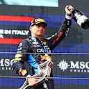 IMOLA, ITALY - MAY 19: Race winner Max Verstappen of the Netherlands and Oracle Red Bull Racing celebrates on the podium during the F1 Grand Prix of Emilia-Romagna at Autodromo Enzo e Dino Ferrari Circuit on May 19, 2024 in Imola, Italy. (Photo by Mark Thompson/Getty Images)