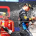 IMOLA, ITALY - MAY 19: Race winner Max Verstappen of the Netherlands and Oracle Red Bull Racing celebrates on the podium during the F1 Grand Prix of Emilia-Romagna at Autodromo Enzo e Dino Ferrari Circuit on May 19, 2024 in Imola, Italy. (Photo by Mark Thompson/Getty Images)