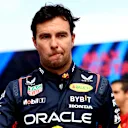 IMOLA, ITALY - MAY 19: 8th placed Sergio Perez of Mexico and Oracle Red Bull Racing looks on in parc ferme during the F1 Grand Prix of Emilia-Romagna at Autodromo Enzo e Dino Ferrari Circuit on May 19, 2024 in Imola, Italy. (Photo by Bryn Lennon - Formula 1/Formula 1 via Getty Images)