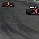 IMOLA, ITALY - MAY 19: Carlos Sainz of Spain driving (55) the Ferrari SF-24 leads Oscar Piastri of Australia driving the (81) McLaren MCL38 Mercedes during the F1 Grand Prix of Emilia-Romagna at Autodromo Enzo e Dino Ferrari Circuit on May 19, 2024 in Imola, Italy. (Photo by Rudy Carezzevoli/Getty Images)
