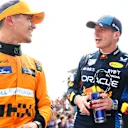 IMOLA, ITALY - MAY 19: Race winner Max Verstappen of the Netherlands and Oracle Red Bull Racing and Second placed Lando Norris of Great Britain and McLaren talk in parc ferme during the F1 Grand Prix of Emilia-Romagna at Autodromo Enzo e Dino Ferrari Circuit on May 19, 2024 in Imola, Italy. (Photo by Mark Thompson/Getty Images)