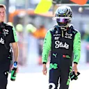 IMOLA, ITALY - MAY 18: 17th placed qualifier Zhou Guanyu of China and Stake F1 Team Kick Sauber walks in the Pitlane during qualifying ahead of the F1 Grand Prix of Emilia-Romagna at Autodromo Enzo e Dino Ferrari Circuit on May 18, 2024 in Imola, Italy. (Photo by Bryn Lennon - Formula 1/Formula 1 via Getty Images)