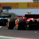 BUDAPEST, HUNGARY - JULY 21: Fernando Alonso of Spain driving the (14) Aston Martin AMR24 Mercedes leads Carlos Sainz of Spain driving (55) the Ferrari SF-24 on track during the F1 Grand Prix of Hungary at Hungaroring on July 21, 2024 in Budapest, Hungary. (Photo by Bryn Lennon - Formula 1/Formula 1 via Getty Images)