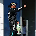 BUDAPEST, HUNGARY - JULY 21: Third placed Lewis Hamilton of Great Britain and Mercedes celebrates on the podium during the F1 Grand Prix of Hungary at Hungaroring on July 21, 2024 in Budapest, Hungary. (Photo by Joe Portlock - Formula 1/Formula 1 via Getty Images)