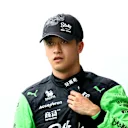 BUDAPEST, HUNGARY - JULY 20: 18th placed qualifier Zhou Guanyu of China and Stake F1 Team Kick Sauber walks in the Pitlane during qualifying ahead of the F1 Grand Prix of Hungary at Hungaroring on July 20, 2024 in Budapest, Hungary. (Photo by Bryn Lennon - Formula 1/Formula 1 via Getty Images)