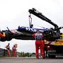 BUDAPEST, HUNGARY - JULY 20: The car of Yuki Tsunoda of Japan and Visa Cash App RB is recovered from the circuit after a crash during qualifying ahead of the F1 Grand Prix of Hungary at Hungaroring on July 20, 2024 in Budapest, Hungary. (Photo by Dean Mouhtaropoulos/Getty Images)