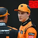 BUDAPEST, HUNGARY - JULY 20: Pole position qualifier Lando Norris of Great Britain and McLaren and Second placed qualifier Oscar Piastri of Australia and McLaren talk in parc ferme during qualifying ahead of the F1 Grand Prix of Hungary at Hungaroring on July 20, 2024 in Budapest, Hungary. (Photo by Rudy Carezzevoli/Getty Images)