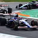 MONZA, ITALY - SEPTEMBER 01: Daniel Ricciardo of Australia driving the (3) Visa Cash App RB VCARB 01 leads Kevin Magnussen of Denmark driving the (20) Haas F1 VF-24 Ferrari on track during the F1 Grand Prix of Italy at Autodromo Nazionale Monza on September 01, 2024 in Monza, Italy. (Photo by Mark Thompson/Getty Images)