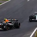 MONZA, ITALY - SEPTEMBER 01: Sergio Perez of Mexico driving the (11) Oracle Red Bull Racing RB20 leads George Russell of Great Britain driving the (63) Mercedes AMG Petronas F1 Team W15 on track during the F1 Grand Prix of Italy at Autodromo Nazionale Monza on September 01, 2024 in Monza, Italy. (Photo by Joe Portlock - Formula 1/Formula 1 via Getty Images)