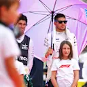 MONZA, ITALY - SEPTEMBER 01: Lance Stroll of Canada and Aston Martin F1 Team and Esteban Ocon of France and Alpine F1 looks on, on the grid during the F1 Grand Prix of Italy at Autodromo Nazionale Monza on September 01, 2024 in Monza, Italy. (Photo by Bryn Lennon - Formula 1/Formula 1 via Getty Images)