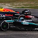 MONZA, ITALY - SEPTEMBER 01: George Russell of Great Britain driving the (63) Mercedes AMG Petronas F1 Team W15 runs wide during a battle with Sergio Perez of Mexico driving the (11) Oracle Red Bull Racing RB20 during the F1 Grand Prix of Italy at Autodromo Nazionale Monza on September 01, 2024 in Monza, Italy. (Photo by Joe Portlock - Formula 1/Formula 1 via Getty Images)