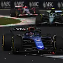 MONZA, ITALY - SEPTEMBER 01: Alexander Albon of Thailand driving the (23) Williams FW46 Mercedes leads Fernando Alonso of Spain driving the (14) Aston Martin AMR24 Mercedes on track during the F1 Grand Prix of Italy at Autodromo Nazionale Monza on September 01, 2024 in Monza, Italy. (Photo by Rudy Carezzevoli/Getty Images)