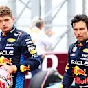 MONZA, ITALY - SEPTEMBER 01: Sixth place Max Verstappen of the Netherlands and Oracle Red Bull Racing and eighth place Sergio Perez of Mexico and Oracle Red Bull Racing, look on in parc ferme  during the F1 Grand Prix of Italy at Autodromo Nazionale Monza on September 01, 2024 in Monza, Italy. (Photo by Mark Thompson/Getty Images)
