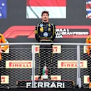 MONZA, ITALY - SEPTEMBER 01: Race winner Charles Leclerc of Monaco and Ferrari, with Second placed Oscar Piastri of Australia and McLaren and Third placed Lando Norris of Great Britain and McLaren, on the podium during the F1 Grand Prix of Italy at Autodromo Nazionale Monza on September 01, 2024 in Monza, Italy. (Photo by Clive Rose/Getty Images)