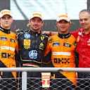 MONZA, ITALY - SEPTEMBER 01: Race winner Charles Leclerc of Monaco and Ferrari, with Second placed Oscar Piastri of Australia and McLaren, Third placed Lando Norris of Great Britain and McLaren and Diego Ioverno of Ferrari during the F1 Grand Prix of Italy at Autodromo Nazionale Monza on September 01, 2024 in Monza, Italy. (Photo by Clive Rose/Getty Images)