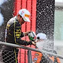 MONZA, ITALY - SEPTEMBER 01: Race winner Charles Leclerc of Monaco and Ferrari celebrates on the podium during the F1 Grand Prix of Italy at Autodromo Nazionale Monza on September 01, 2024 in Monza, Italy. (Photo by James Sutton - Formula 1/Formula 1 via Getty Images)