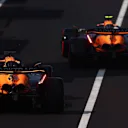 MONZA, ITALY - AUGUST 31: Lando Norris of Great Britain driving the (4) McLaren MCL38 Mercedes and Oscar Piastri of Australia driving the (81) McLaren MCL38 Mercedes in the Pitlane during qualifying ahead of the F1 Grand Prix of Italy at Autodromo Nazionale Monza on August 31, 2024 in Monza, Italy. (Photo by Bryn Lennon - Formula 1/Formula 1 via Getty Images)