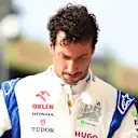MONZA, ITALY - AUGUST 31: Twelfth qualifier Daniel Ricciardo of Australia and Visa Cash App RB walks in the Pitlane during qualifying ahead of the F1 Grand Prix of Italy at Autodromo Nazionale Monza on August 31, 2024 in Monza, Italy. (Photo by Bryn Lennon - Formula 1/Formula 1 via Getty Images)