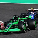 SUZUKA, JAPAN - APRIL 07: Valtteri Bottas of Finland driving the (77) Kick Sauber C44 Ferrari leads Logan Sargeant of United States driving the (2) Williams FW46 Mercedes during the F1 Grand Prix of Japan at Suzuka International Racing Course on April 07, 2024 in Suzuka, Japan. (Photo by Clive Rose - Formula 1/Formula 1 via Getty Images)