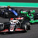 SUZUKA, JAPAN - APRIL 07: Kevin Magnussen of Denmark driving the (20) Haas F1 VF-24 Ferrari leads Valtteri Bottas of Finland driving the (77) Kick Sauber C44 Ferrari and Logan Sargeant of United States driving the (2) Williams FW46 Mercedes during the F1 Grand Prix of Japan at Suzuka International Racing Course on April 07, 2024 in Suzuka, Japan. (Photo by Clive Rose - Formula 1/Formula 1 via Getty Images)