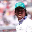 SUZUKA, JAPAN - APRIL 07: Lance Stroll of Canada and Aston Martin F1 Team looks on from the grid prior to the F1 Grand Prix of Japan at Suzuka International Racing Course on April 07, 2024 in Suzuka, Japan. (Photo by Bryn Lennon - Formula 1/Formula 1 via Getty Images)