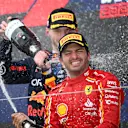 SUZUKA, JAPAN - APRIL 07: Race winner Max Verstappen of the Netherlands and Oracle Red Bull Racing and Third placed Carlos Sainz of Spain and Ferrari celebrate on the podium during the F1 Grand Prix of Japan at Suzuka International Racing Course on April 07, 2024 in Suzuka, Japan. (Photo by Clive Mason/Getty Images)