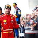 SUZUKA, JAPAN - APRIL 07: Third placed Carlos Sainz of Spain and Ferrari celebrates on the podium during the F1 Grand Prix of Japan at Suzuka International Racing Course on April 07, 2024 in Suzuka, Japan. (Photo by Mark Thompson/Getty Images)