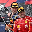 SUZUKA, JAPAN - APRIL 07: Race winner Max Verstappen of the Netherlands and Oracle Red Bull Racing and Third placed Carlos Sainz of Spain and Ferrari celebrate on the podium during the F1 Grand Prix of Japan at Suzuka International Racing Course on April 07, 2024 in Suzuka, Japan. (Photo by Clive Mason/Getty Images)