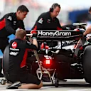 SUZUKA, JAPAN - APRIL 06: Nico Hulkenberg of Germany driving the (27) Haas F1 VF-24 Ferrari stops in the Pitlane during qualifying ahead of the F1 Grand Prix of Japan at Suzuka International Racing Course on April 06, 2024 in Suzuka, Japan. (Photo by Bryn Lennon - Formula 1/Formula 1 via Getty Images)