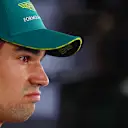 SUZUKA, JAPAN - APRIL 06: 16th placed qualifier Lance Stroll of Canada and Aston Martin F1 Team looks on in the Paddock during qualifying ahead of the F1 Grand Prix of Japan at Suzuka International Racing Course on April 06, 2024 in Suzuka, Japan. (Photo by Clive Rose - Formula 1/Formula 1 via Getty Images)