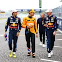 SUZUKA, JAPAN - APRIL 06: Pole position qualifier Max Verstappen of the Netherlands and Oracle Red Bull Racing (R), Second placed qualifier Sergio Perez of Mexico and Oracle Red Bull Racing (L) and Third placed qualifier Lando Norris of Great Britain and McLaren (C) walk in parc ferme during qualifying ahead of the F1 Grand Prix of Japan at Suzuka International Racing Course on April 06, 2024 in Suzuka, Japan. (Photo by Mark Thompson/Getty Images)