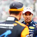 SUZUKA, JAPAN - APRIL 06: Second placed qualifier Sergio Perez of Mexico and Oracle Red Bull Racing talks with Third placed qualifier Lando Norris of Great Britain and McLaren in parc ferme during qualifying ahead of the F1 Grand Prix of Japan at Suzuka International Racing Course on April 06, 2024 in Suzuka, Japan. (Photo by Mark Thompson/Getty Images)