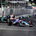 LAS VEGAS, NEVADA - NOVEMBER 23: Liam Lawson of New Zealand driving the (30) Visa Cash App RB VCARB 01 leads Fernando Alonso of Spain driving the (14) Aston Martin AMR24 Mercedes during the F1 Grand Prix of Las Vegas at Las Vegas Strip Circuit on November 23, 2024 in Las Vegas, Nevada. (Photo by Chris Graythen/Getty Images)
