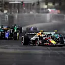 LAS VEGAS, NEVADA - NOVEMBER 23: Sergio Perez of Mexico driving the (11) Oracle Red Bull Racing RB20 and Fernando Alonso of Spain driving the (14) Aston Martin AMR24 Mercedes compete for track position during the F1 Grand Prix of Las Vegas at Las Vegas Strip Circuit on November 23, 2024 in Las Vegas, Nevada. (Photo by Chris Graythen/Getty Images)