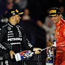 LAS VEGAS, NEVADA - NOVEMBER 23: Second placed Lewis Hamilton of Great Britain and Mercedes and Third placed Carlos Sainz of Spain and Ferrari celebrate on the podium during the F1 Grand Prix of Las Vegas at Las Vegas Strip Circuit on November 23, 2024 in Las Vegas, Nevada. (Photo by Chris Graythen/Getty Images)
