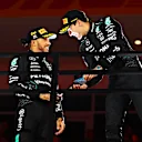 LAS VEGAS, NEVADA - NOVEMBER 23: Race winner George Russell of Great Britain and Mercedes and Second placed Lewis Hamilton of Great Britain and Mercedes celebrate on the podium during the F1 Grand Prix of Las Vegas at Las Vegas Strip Circuit on November 23, 2024 in Las Vegas, Nevada. (Photo by Mark Sutton - Formula 1/Formula 1 via Getty Images)