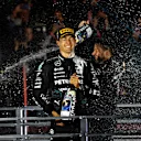 LAS VEGAS, NEVADA - NOVEMBER 23: Race winner George Russell of Great Britain and Mercedes celebrates on the podium during the F1 Grand Prix of Las Vegas at Las Vegas Strip Circuit on November 23, 2024 in Las Vegas, Nevada. (Photo by Chris Graythen/Getty Images)