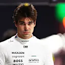 LAS VEGAS, NEVADA - NOVEMBER 22: 20th placed qualifier Lance Stroll of Canada and Aston Martin F1 Team walks in the Pitlane during qualifying ahead of the F1 Grand Prix of Las Vegas at Las Vegas Strip Circuit on November 22, 2024 in Las Vegas, Nevada. (Photo by Clive Rose - Formula 1/Formula 1 via Getty Images)