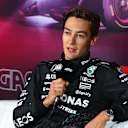 LAS VEGAS, NEVADA - NOVEMBER 22: Pole position qualifier George Russell of Great Britain and Mercedes attends the press conference after qualifying ahead of the F1 Grand Prix of Las Vegas at Las Vegas Strip Circuit on November 22, 2024 in Las Vegas, Nevada. (Photo by Mark Sutton - Formula 1/Formula 1 via Getty Images)