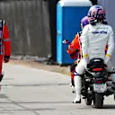 MEXICO CITY, MEXICO - OCTOBER 27: Alexander Albon of Thailand and Williams takes a ride on a bike after crashing at the start during the F1 Grand Prix of Mexico at Autodromo Hermanos Rodriguez on October 27, 2024 in Mexico City, Mexico. (Photo by Peter Fox - Formula 1/Formula 1 via Getty Images)