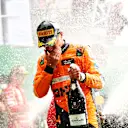 MEXICO CITY, MEXICO - OCTOBER 27: Second placed Lando Norris of Great Britain and McLaren celebrates on the podium after the F1 Grand Prix of Mexico at Autodromo Hermanos Rodriguez on October 27, 2024 in Mexico City, Mexico. (Photo by Bryn Lennon - Formula 1/Formula 1 via Getty Images)