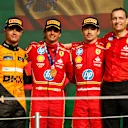 MEXICO CITY, MEXICO - OCTOBER 27: Race winner Carlos Sainz of Spain and Ferrari, Second placed Lando Norris of Great Britain and McLaren and Third placed Charles Leclerc of Monaco and Ferrari pose for a photo on the podium after the F1 Grand Prix of Mexico at Autodromo Hermanos Rodriguez on October 27, 2024 in Mexico City, Mexico. (Photo by Chris Graythen/Getty Images)